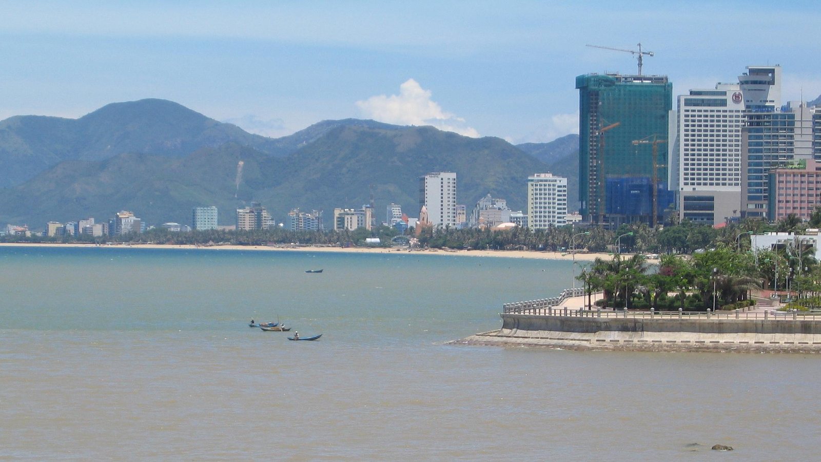Nha Trang skyline along the coastline with blue water and a long urban beachfront